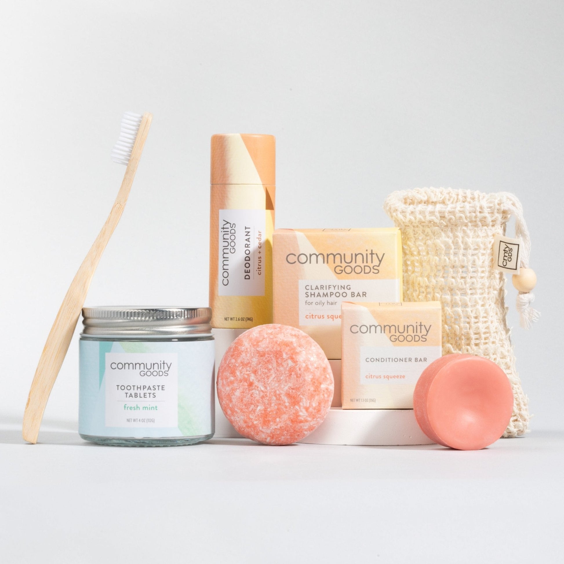 Sustainable personal care bundle by Community Goods with the best shampoo bar, best plastic-free deodorant, best toothpaste tablets, and bamboo toothbrush